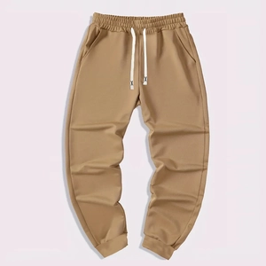 Men's khaki joggers with elastic drawstring waist and cuffed ankles for high street sports