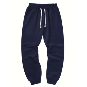 Detail of navy blue joggers showing elastic waistband with contrast white drawstrings