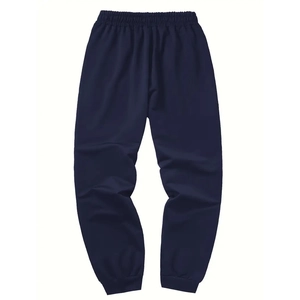 Detail of navy blue joggers with elastic waistband and ribbed cuffs on white background