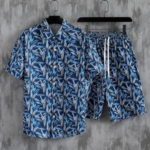 Summer men's Hawaiian shirt and shorts set with tropical blue leaf prints for beach