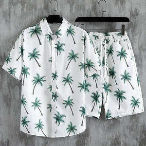 Detail of tropical green palm tree print on white men's short sleeve shirt and shorts set