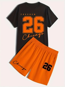 Detail of black T-shirt and orange shorts with Number 26 and Chicago prints