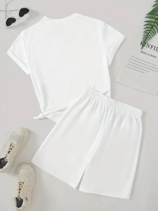 Minimalist white summer lounge set with knotted t-shirt and wide leg shorts