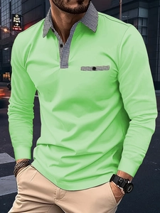 Detail of bright green polo shirt showing houndstooth pattern on collar and chest pocket