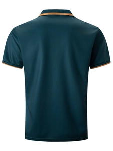 Detail view of the back of a dark cyan men's polo shirt with orange striped cuff trim