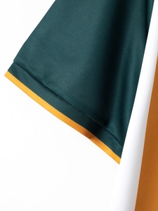 Close-up of breathable mesh fabric and color-blocked rib cuffs on a men's polo shirt