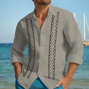 Detail of light gray long sleeve shirt with black vertical wave embroidery and buttons