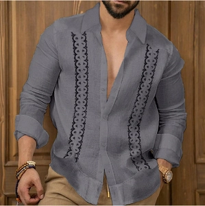 Detailed view of grey linen-blend shirt with ethnic geometric embroidery patterns
