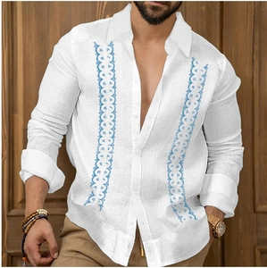 Detail of white cotton linen men's shirt featuring blue vertical wave embroidered stripes