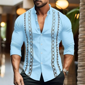 Detail of light blue striped shirt featuring brown geometric diamond patterns and buttons
