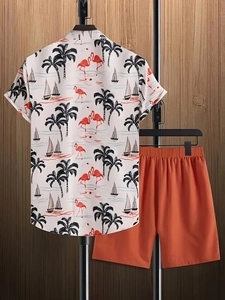 Men's summer set with tropical print shirt and brick red shorts hanging on wooden wall
