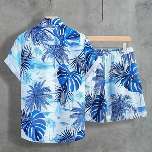 Detail view of summer men's tropical print set featuring blue palm trees and boat patterns