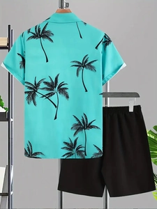 Detail of turquoise tropical shirt with black palm prints and casual black drawstring shorts