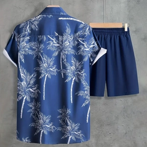 Detail of navy blue men's summer set with palm tree print shirt and matching shorts