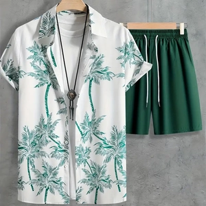 Detail of men's summer set with palm leaf print shirt and green drawstring shorts