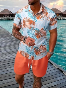 Men's vacation set with palm leaf print shirt and orange shorts by the sea