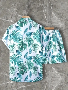 Detail view of men's summer set showing tropical leaf print on white fabric