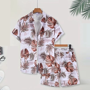 Close-up of men's summer set featuring brown tropical palm leaf print on white fabric