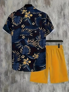 Detail of navy tropical print shirt and yellow casual shorts set for men's summer style