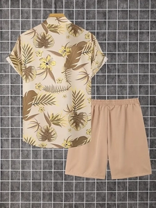 Detail view of tropical palm leaf print shirt and khaki shorts summer set
