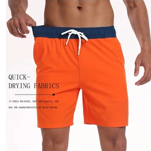 Détail du short de bain homme à séchage rapide, tissu orange avec taille bleue et cordon