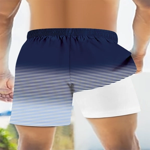 Detail of 2-in-1 men's swim shorts with navy gradient stripes and white inner liner