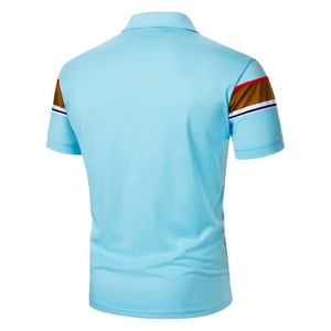 Detail of light blue men's polo shirt showing the striped knit cuff and breathable fabric