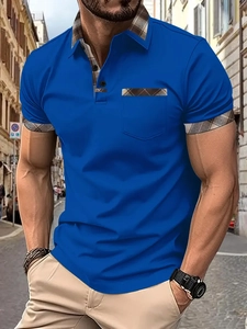Detailed close-up of blue polo shirt showing plaid collar and pocket detail on outdoor background