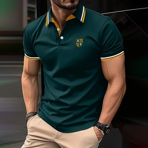 Detail of slim fit polo shirt featuring contrast striped collar and shield embroidery