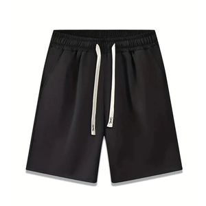 Detailed view of black drawstring shorts featuring reinforced X-stitch on white cords