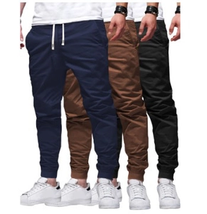 Detail of drawstring waistband and ribbed cuffs on men's solid color joggers