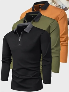 Detail of three men's quarter-zip polo shirts in black, olive green, and ginger colors