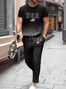 Action shot of men's black 2-piece summer set with USA flag and text graphic