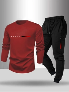 Detail view of the red long sleeve shirt and black joggers set with Paris print design