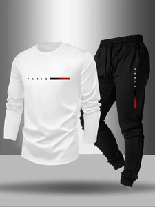 Detail of the crewneck sweatshirt and joggers set featuring a Paris letter print design