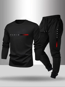 Detail of black sports set with PARIS lettering and drawstring waistband on joggers