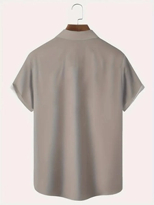 Back view of a men's short-sleeved Hawaiian shirt with 3D shrub and grass print in khaki
