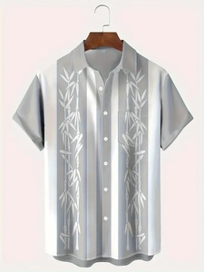 Detail view of men's vertical striped shirt with bamboo leaf print and chest pocket