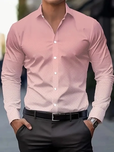 Detail of pink long sleeve shirt showing unique geometric texture and white pearl buttons