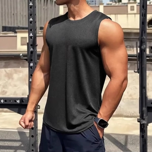 Detail of grey compression tank top fabric texture on muscular athlete outdoors