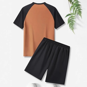 Back view of men's two-piece sports set featuring raglan sleeve T-shirt and black shorts