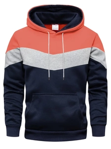 Detail of hoodie drawstring hood and ribbed cuffs in orange gray blue color block