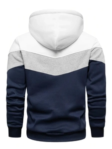 Detail view of men's tricolor patchwork hoodie in white, light grey, and navy blue