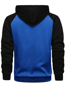Detail of blue and black raglan hoodie featuring ribbed cuffs and high-quality fabric texture