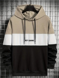 Detail of color-block hoodie with KEEP LEARNING slogan and drawstring hood