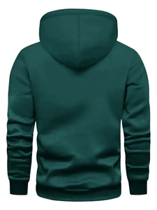 Back view of dark green loose hoodie with ribbed cuffs and clean stitching details