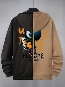 Detailed back view of a color-block hoodie with a cartoon astronaut print and text