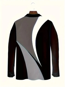 Detail of long-sleeved polo shirt featuring modern black, grey, and white patchwork design