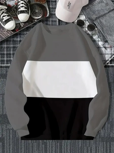 Détail du sweat à manches longues color-block avec panneaux gris blancs et noirs