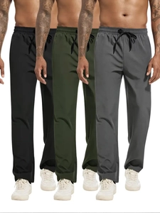 Mens casual joggers detail showing black army green and grey colors with drawstring waist